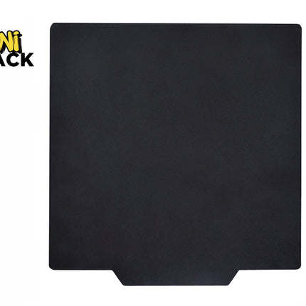 A square matte black stove mat with a bottom center cutout tab against a white background. A "Kiwi Shack" logo appears in the top-left corner.