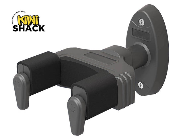 Dark gray wall-mounted guitar hanger/yoke with black foam padding on the fork arms, locking vertical drop-guards, oval baseplate with two mounting screws, and Kiwi Shack logo in top left.