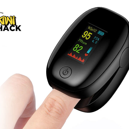 Black pulse oximeter on a finger with Kiwi Shack logo in the corner