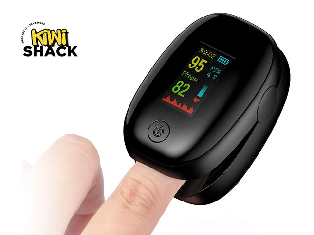 Black pulse oximeter on a finger with Kiwi Shack logo in the corner