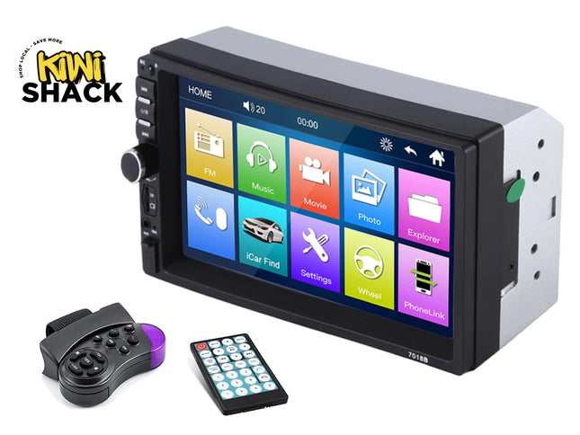 A car stereo headunit with a colorful touchscreen display, shown with a wired remote control and a wireless controller on a white background. The Kiwi Shack logo is visible in the top-left corner.