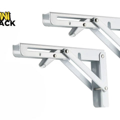 A pair of folding white metal shelf brackets with adjustable support arms and wall mounting plates against a white background, featuring the "Kiwi Shack" logo in the upper left corner.
