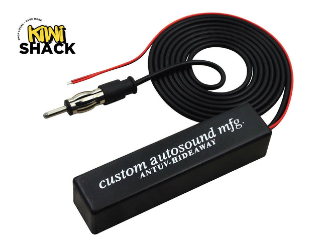 A Custom Autosound antenna hideaway module with its connected coiled cable, antenna plug, and power wire, featuring the "Kiwi Shack" logo in the corner.