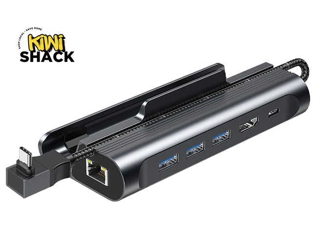 A black multi-port USB hub with an integrated power adapter, shown on a white background with a Kiwi Shack logo in the top-left corner.