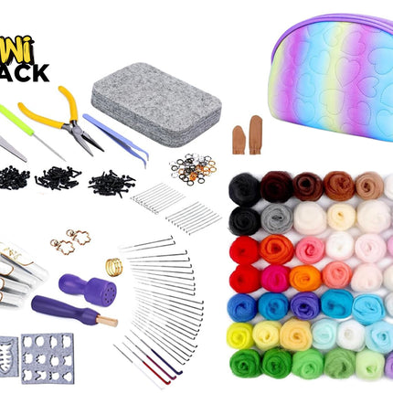 A Kiwi Shack craft kit laid out on a white background, including a rainbow-colored zip pouch, a gray felt block, scissors, tweezers, metal findings, wooden sticks, needles, stamps, and many rolled yarn or fabric colors arranged in a grid.