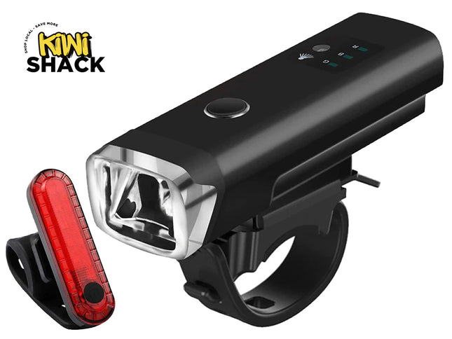 A black rechargeable bicycle headlight with an attached handlebar mounting bracket and a separate red LED rear tail light against a white background. A "Kiwi Shack" logo appears in the top-left corner.