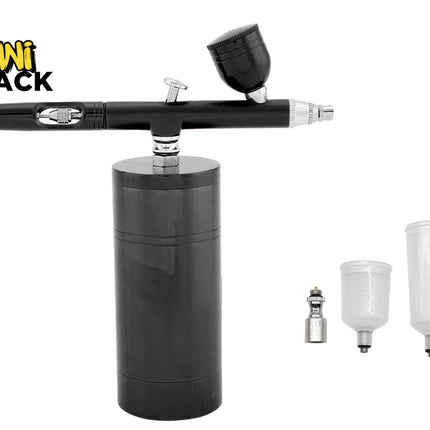 A black Kiwi Shack airbrush with a black cylindrical base, shown on a white background with three clear plastic paint cups and a small metal tip included.