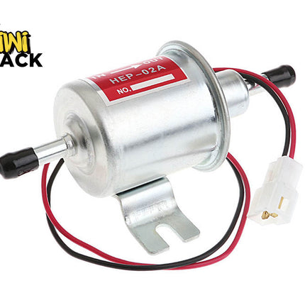 Silver cylindrical electric fuel pump labeled "HEP-02A", featuring inlet/outlet metal nozzles with black protective caps, a mounting bracket base, and red/black wires with a white connector plug, branded with the "Kiwi Shack" logo in the top-left corner.