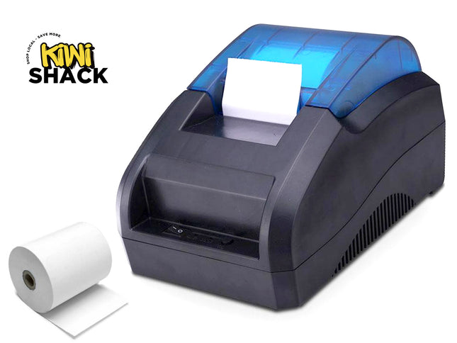 A black and blue thermal paper label printer shown on a white background with a roll of white paper and a Kiwi Shack logo in the top-left corner.
