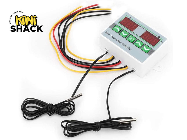 A dual digital temperature controller module with dual LED displays, programming buttons, wiring harnesses, and two NTC probe sensors, featuring the "Kiwi Shack" logo in the top-left corner.