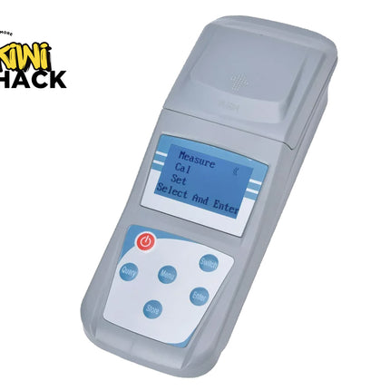 Gray electronic device with screen and buttons on a white background, featuring Kini Shack logo.