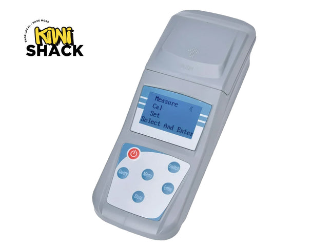 Gray electronic device with screen and buttons on a white background, featuring Kini Shack logo.
