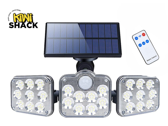 Solar light fixture with three LED panels, a solar panel, and remote control on a white background. Brand 'Kiwi Shack' visible.
