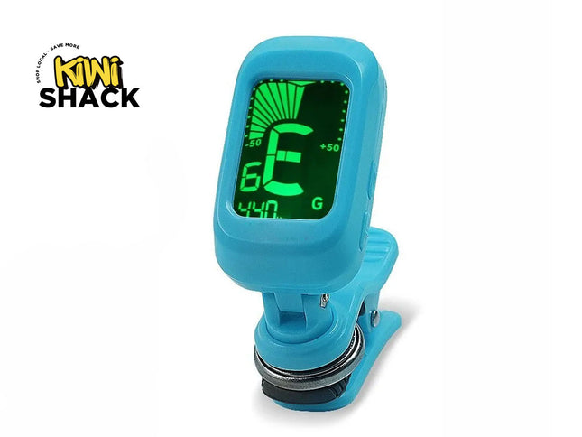 A bright blue clip-on electronic instrument tuner with a glowing green digital display showing the note "E", featuring a "Kiwi Shack" logo in the top left corner.