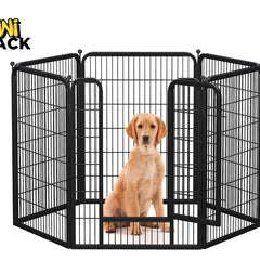 Dog inside a black metal pet playpen with 'Kiwi Shack' branding.