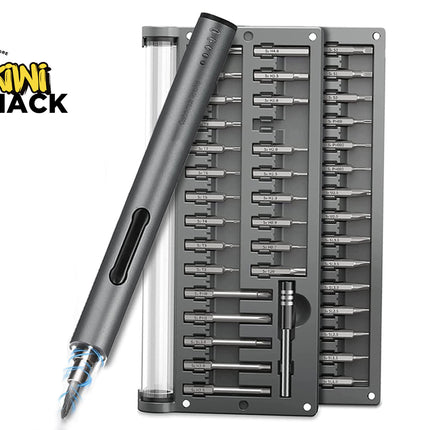 A Kiwi Shack electric screwdriver with a dark gray metallic body, shown alongside its storage tray and a clear cylindrical battery case on a white background. The Kiwi Shack logo is visible in the top-left corner.