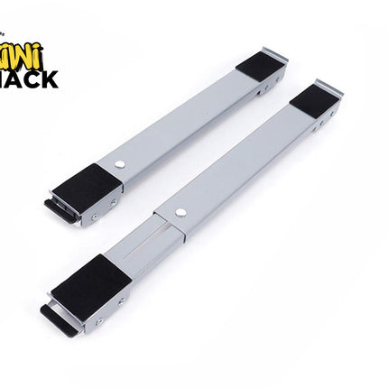 A pair of adjustable gray appliance roller stands or furniture moving bars with black non-slip pads at each end, featuring a "Kiwi Shack" logo in the top left corner.