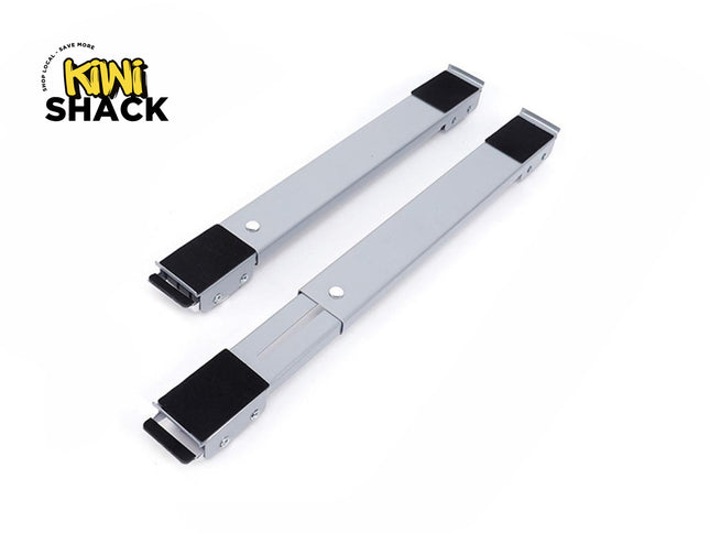 A pair of adjustable gray appliance roller stands or furniture moving bars with black non-slip pads at each end, featuring a "Kiwi Shack" logo in the top left corner.