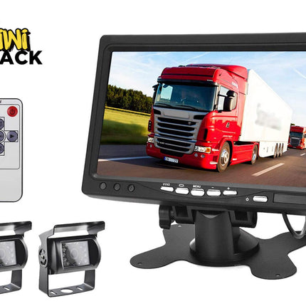 A backup camera and monitor kit featuring a large dashboard display showing a red semi-truck, a handheld remote control, and two rearview cameras with mounting brackets against a white background, with the "Kiwi Shack" logo in the upper left corner.