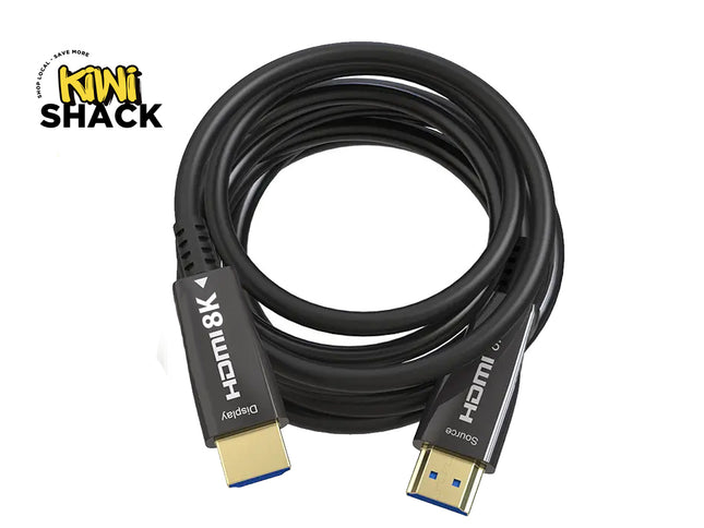 A coiled black HDMI 8K cable with gold and blue connector tips, shown on a white background with a Kiwi Shack logo in the top-left corner.