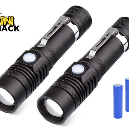 Two black tactical LED flashlights with silver pocket clips and white buttons, shown alongside two blue batteries on a white background with the Kiwi Shack logo in the top-left corner.