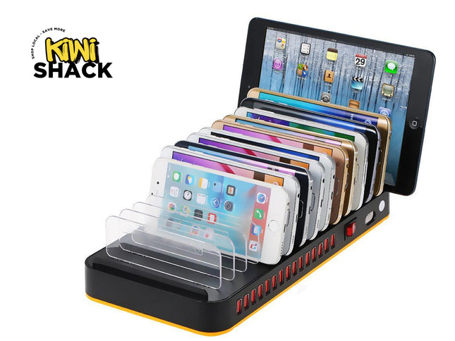 Multi-device charging station with smartphones and a tablet on a white background, featuring the Kiwi Shack brand.