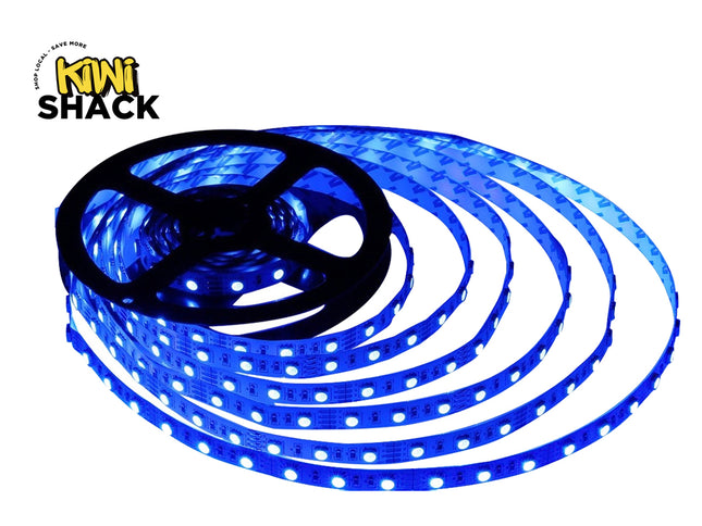 A spool of glowing blue LED strip lights uncoiled against a white background, with the "Kiwi Shack" logo visible in the upper left corner.