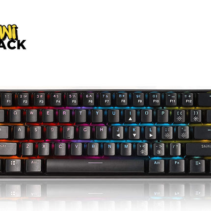 A black mini mechanical keyboard with RGB rainbow backlighting, shown from a top-down angle on a white background with a reflection below. The 'Kini Shack' brand logo is visible in the top-left corner.