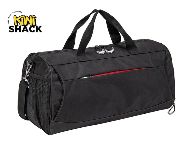 Black sports duffel bag with dual top carry handles, a side mesh pocket, a front zipper compartment with a red accent strip, detachable shoulder strap clips, and the Kiwi Shack logo watermark.
