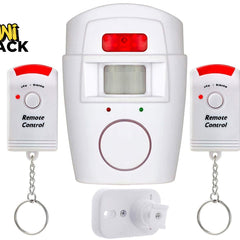 A white infrared wireless motion sensor alarm system with a mounting bracket and two remote control keychains, featuring the "Kiwi Shack" logo in the top-left corner.