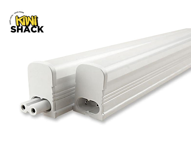Two linear LED tube light fixtures with white grooved housings and end caps, showing male and female plug connector ends side-by-side, featuring Kiwi Shack logo in top left.