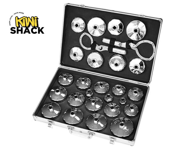 An open metal carrying case containing a comprehensive set of chrome oil filter socket wrenches and strap wrenches neatly organized in custom foam slots against a white background, featuring the "Kiwi Shack" logo in the upper left corner.