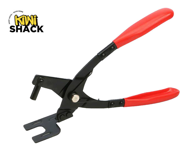 Black automotive upholstery clip pliers with red dipped comfort grip handles and a slotted lower jaw mechanism, featuring a "Kiwi Shack" logo in the top left corner.