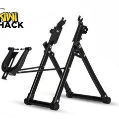 A black foldable bicycle repair and maintenance stand with a frame holder cradle on the front against a white background, featuring the "Kiwi Shack" logo in the upper left corner.