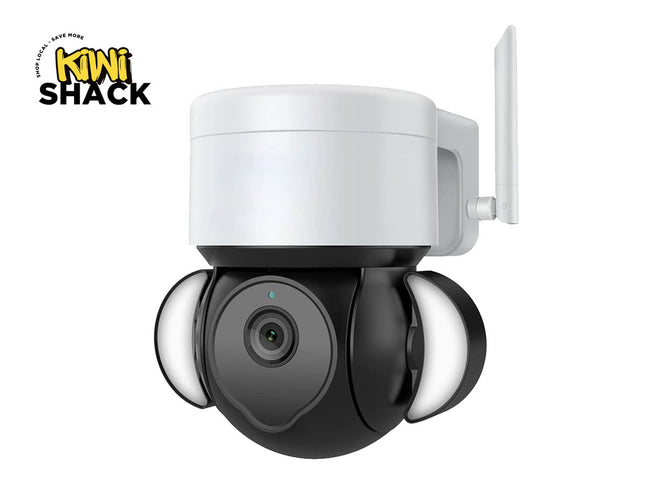 A white and black wireless security camera with three LED light bars, shown on a white background with a Kiwi Shack logo in the top-left corner.