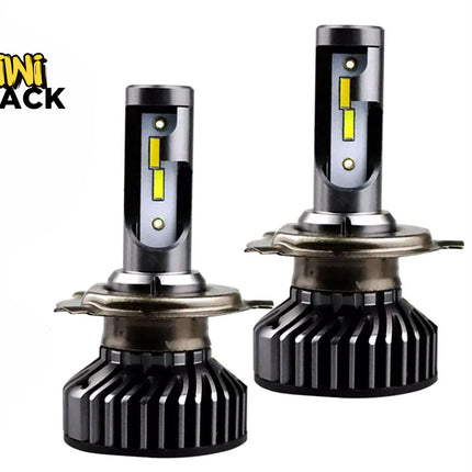 Pair of LED automotive headlight bulbs with yellow LED chips on metal stems, finned passive heat sink bases, and retention collars, branded with the "Kiwi Shack" logo in the top-left corner.