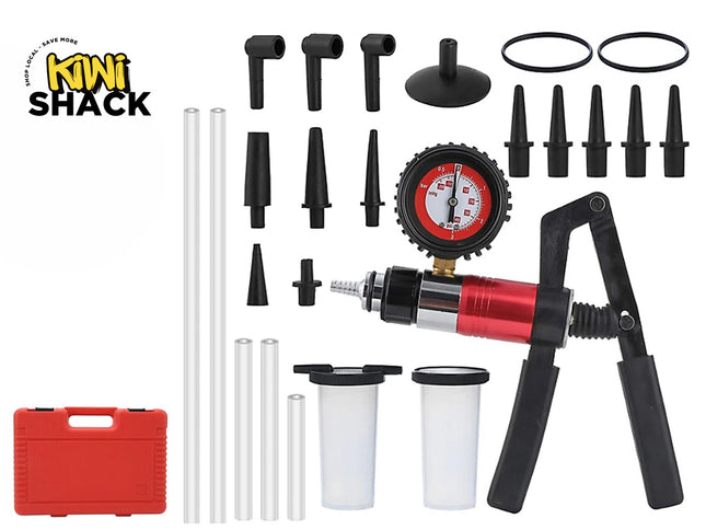 A comprehensive automotive vacuum and pressure test kit featuring a manual hand pump with an integrated red and black gauge, multiple fluid reservoirs, various hoses, adapters, and connectors, next to a red storage case, set against a white background with the "Kiwi Shack" logo in the top left corner.