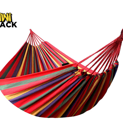 A colorful striped fabric hammock with reinforced woven hanging loops and suspension cords, featuring a "Kiwi Shack" logo in the top left corner.