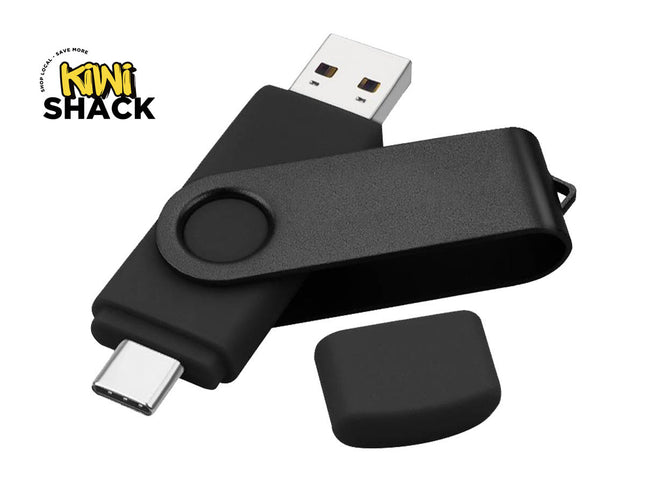 Black dual-interface USB flash drive / OTG thumb drive featuring a USB-A plug at one end, a USB-C plug at the opposite end with a protective cap lying nearby, a rotating/swiveling black metallic U-bracket clip, and the Kiwi Shack logo watermark.
