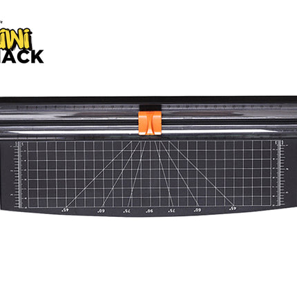 A black rotary paper trimmer featuring a grid-lined base with angle measurement guides and an orange cutting blade handle against a white background, featuring the "Kiwi Shack" logo in the upper left corner.