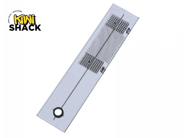 A silver metal measuring ruler with black printed grid lines and markings, shown diagonally on a white background with the 'Mini Shack' logo in the top-left corner.