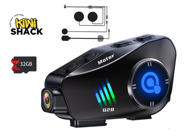 Black electronic device with digital display and camera lens, branded 'Motor', on a white background with 'Kiwi Shack' logo.