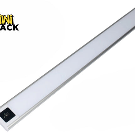 A slim, silver-rimmed LED under-cabinet light bar with a frosted diffuser panel and a motion sensor control module on one end against a white background, featuring the "Kiwi Shack" logo in the upper left corner.