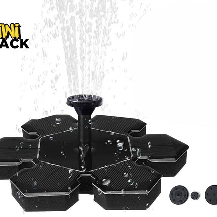 A black floating solar-powered water fountain with a central nozzle spraying water upward, shown with alternative spray heads lined up on the bottom right against a white background. A "Kiwi Shack" logo appears in the top-left corner.