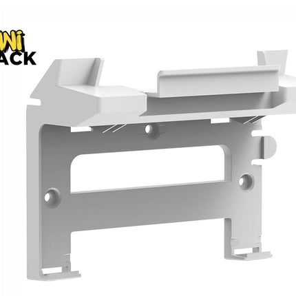 White plastic wall-mounting bracket/dock with countersunk screw holes and upper ledge cradle support, featuring Kiwi Shack logo in top left.
