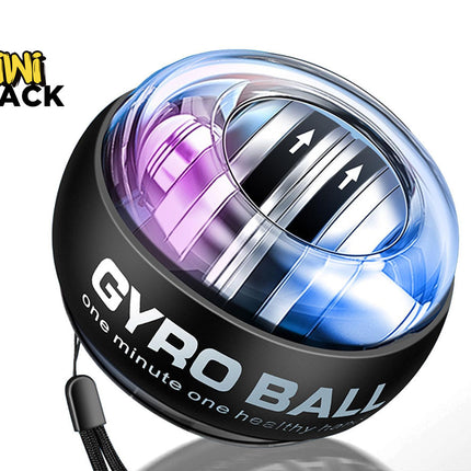 A Kiwi Shack Gyro Ball wrist exerciser shown on a white background. The product features a black outer shell with 'GYRO BALL' printed in white, a clear top dome showing a metallic silver inner ring with directional arrows, and a purple-to-blue iridescent gradient.