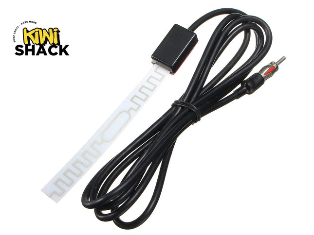 A black coiled cable with a small black rectangular connector block and a red-and-black plug, shown next to a white flexible strip with repeating cutout slots. The product is photographed on a plain white background with the Kiwi Shack logo in the top-left corner.
