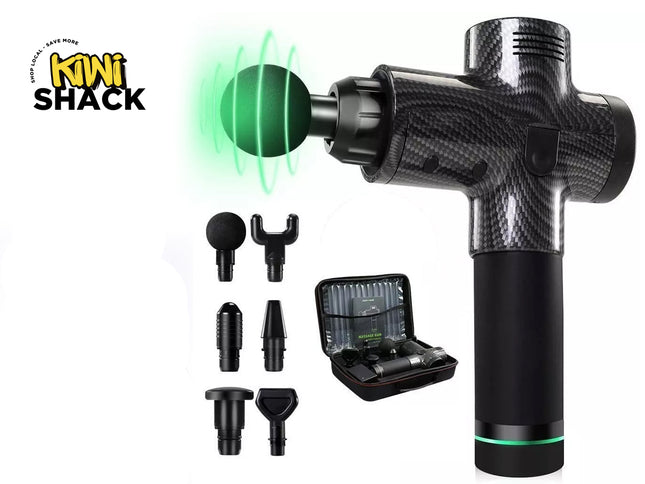 Kiwi Shack handheld massage gun with a carbon fiber pattern body, shown with multiple interchangeable heads, a charging case, and a green glowing head attachment on a white background.