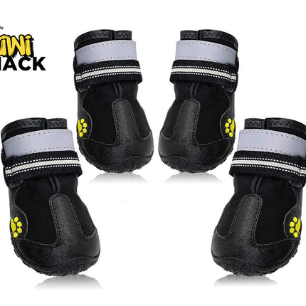 Set of four black dog boots with rubber toe caps, dual reflective/striped Velcro strap closures, yellow paw print accent graphics on the side, textured anti-slip soles, and Kiwi Shack logo watermark.