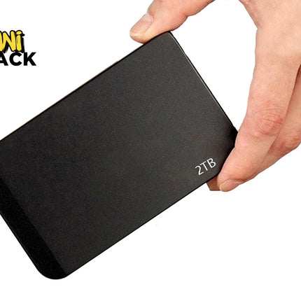 A sleek, black 2TB portable external hard drive held by a hand against a white background, featuring the "Kiwi Shack" logo in the upper left corner.